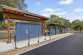 A bus stop with a shelter and a sign that says "Hub".