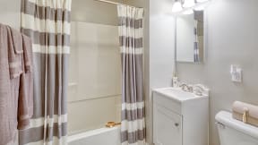a bathroom with a shower and a sink