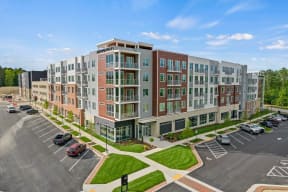 an aerial view of an apartment building with a parking lotat Metropolis Apartments, Glen Allen Virginia