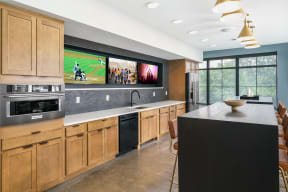 a kitchen with a large center island with a breakfast bar in front of it and a large at Crossline, Columbus, 43201