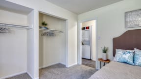 a bedroom with a bed and a closet