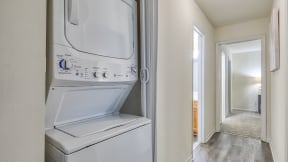 an empty laundry room with a washer and dryer
