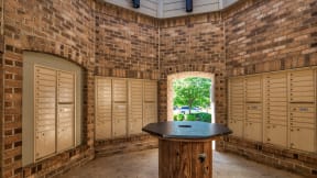 a locker room with lockers and a table in the middle