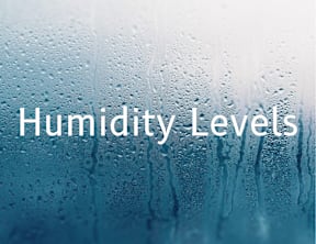 A close-up image of a window with condensation on it, symbolizing humidity levels.