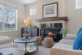 A living room with a fireplace and a couch.