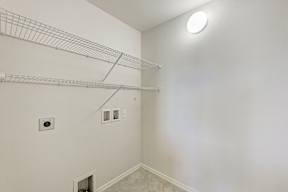 A white wall with a light on it.