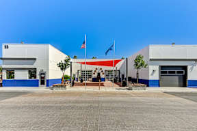 A building with a flag on top and a number 50 on the left side.