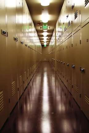 A long hallway with a row of lockers on each side.
