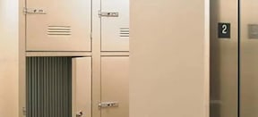 A row of white lockers with the number 2 on the right.