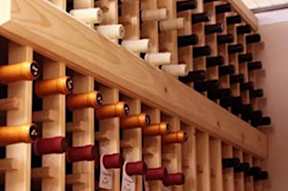 A wine rack with many bottles of wine.
