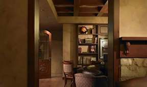 A room with a chair and a table.