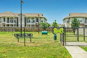 A park with a bench and a sign that says "Picnic".