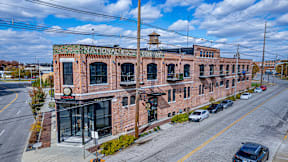 A National Bank building with a green sign on the top.