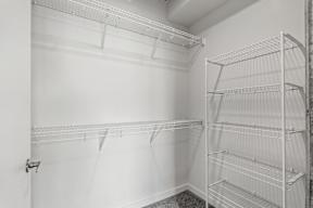Empty white shelves in a room.