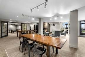 A conference room with a long table and chairs.