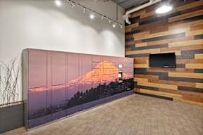 A room with a wooden wall and a TV on it.