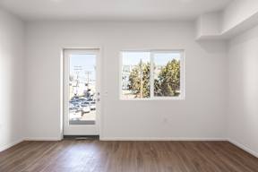 A room with a door and a window.