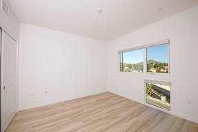 A room with a window and a door.