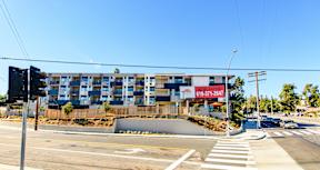 A street view of a building with a sign that reads "819-311-2647".
