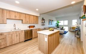 A kitchen with wooden cabinets and a white countertop.