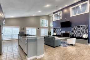 A modern kitchen with a grey and white color scheme.
