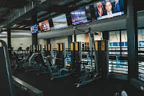 A gym with treadmills and exercise equipment.