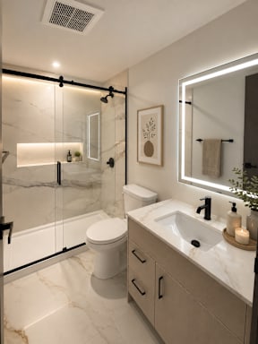 A modern bathroom with a marble countertop and a walk-in shower.