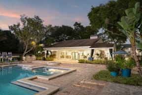 a backyard with a pool and a house