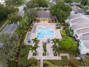 a birds eye view of a pool in the backyard of a house
