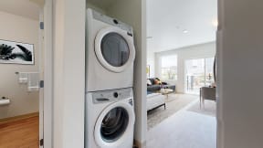 a home with a front load washer and dryer