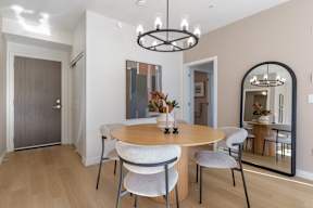 Image of a modern dining room with a round table and chairs in Hillcrest Ave located in Abbotsford, BC