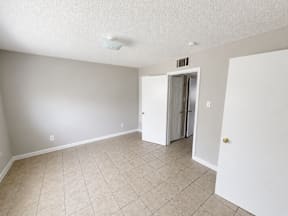 Spacious bedroom with walk in closet located at the pointe apartments in Pasadena, Tx