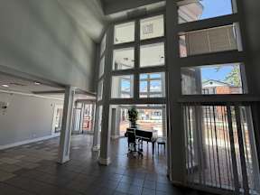 A view of a patio with a table and chairs located at Canfield Lakes Apartments in Houston TX