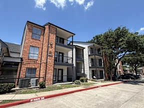Apartment building with spacious parking located at Canfield Lakes Apartments in Houston TX