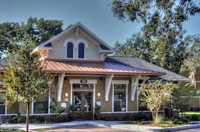A building with a brown roof and a sign that says "101" on it.