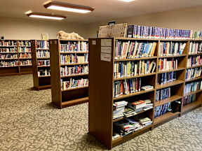 A library with rows of bookshelves.