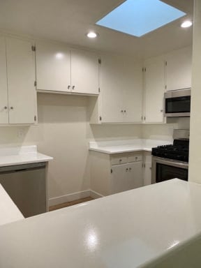 Kitchen with Stainless Steel Appliances and White Cabinets