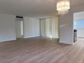 Living Room and Dining Room with Hardwood Floors and Chandelier