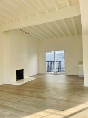 Living Room with High Ceilings and Hard Floors