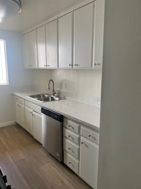 Kitchen with Stainless Steel Appliances and White Cabinets