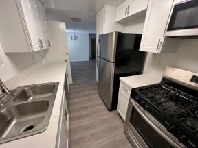 Kitchen with Stainless Steel Appliances and White Cabinets