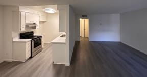 Kitchen and Living Room with Hard Floors and White Cabinets