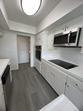 Kitchen with Stainless Steel Appliances and White Cabinets
