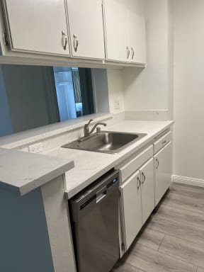 Kitchen with Stainless Steel Appliances and White Cabinets