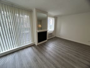 Living Room with Hardwood Floors, Fireplace and Patio Doors