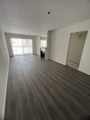 Living Room with Hardwood Floors, Fireplace and Patio Door