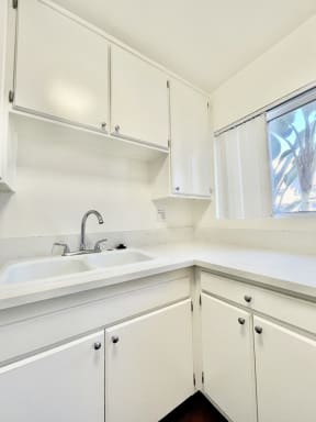 Kitchen with White Appliances and White Cabinets