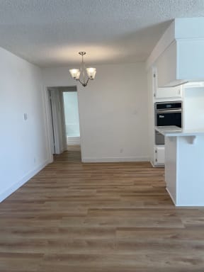 a kitchen and living room in a 555 waverly unit