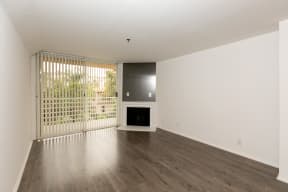 Living Room with Hardwood Floors, Fireplace and Patio Doors