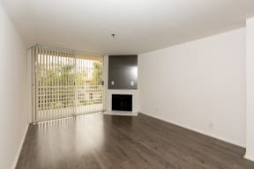 Living Room with Fireplace, Patio Doors and Hardwood Floors